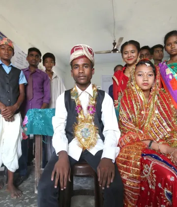 On 21 June 2018 in Nepal, Renuka Kumari Choudhary (left and seated), Rakesh Kumar Shah (right and seated) and other adolescents in Gujara Municipality of Rautahat District perform a skit on child marriage as part of UNFPA-UNICEF Global Programme on Ending Child Marriage. 