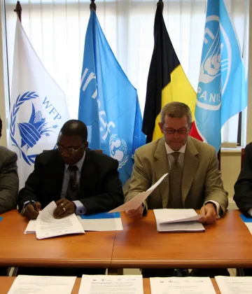 Photographs from an official ceremony in which representatives of the Government of Belgium, UNICEF, WFP and FAO signed a tripartite Memorandum of Understanding to implement a three-year joint programme to respond to the household food security needs of the most vulnerable populations of Abim, Kaberamaido and Kotido Districts in north-eastern Uganda.|A total of US$1.6 million has been committed by Belgium, through the Belgian Survival Fund, to focus on the household and community levels to address household