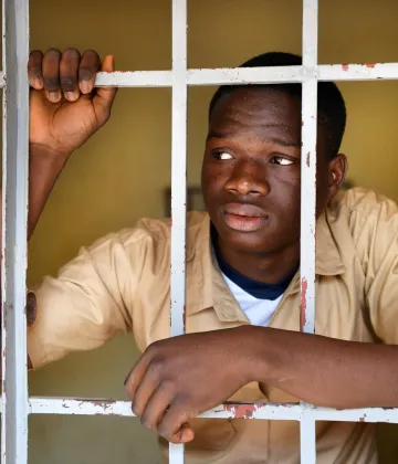 Narcisse Kossi Guinnin, an 18 years old student at his school in Daloa, in west-central Côte d'Ivoire.  Narcisse has been dreaming of immigrating all his life. At the age of sixteen, he attempted to realize his dream, but after a dangerous journey with many obstacles, he was imprisoned in Libya where, after having lived in hell for 5 months, he was repatriated to Côte d'Ivoire.