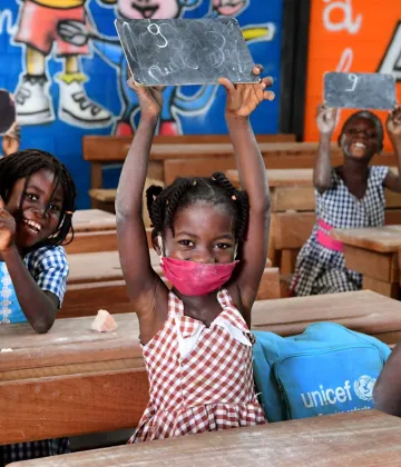 Children attending classes in Toumodi-Sakassou, in the center of Côte d'Ivoire.  Due to COVID-19, the schools were closed for several weeks. Classes started, with the necessary measures. Children wear masks, wash their hands regularly and keep a social distance.