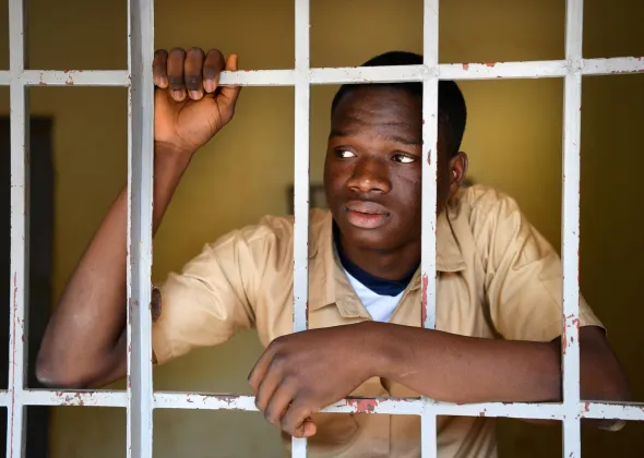 Narcisse Kossi Guinnin, an 18 years old student at his school in Daloa, in west-central Côte d'Ivoire.  Narcisse has been dreaming of immigrating all his life. At the age of sixteen, he attempted to realize his dream, but after a dangerous journey with many obstacles, he was imprisoned in Libya where, after having lived in hell for 5 months, he was repatriated to Côte d'Ivoire.