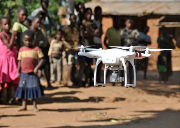 A drone operated by Chief Air Traffic Controller Steve Mkandawire, one of five Civil Aviation certified pilots, takes off during a demonstration for residents in Thipa vllage, Kasungu District, Malawi, Thursday 29 June 2017. Thipa village is 19 kilometres from the nearest health centre in Dwangwa and the only way to get there is either by bicycle or walking for four hours.