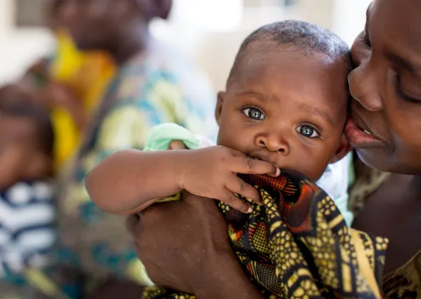Tecla is six months old.  "I am very thankful to God for giving me this baby because it has been very hard since I lost my son."  Bertha Andrews Ndikwege lives in a small one-roomed house in the Mtoni District in Dar Esalaam, Tanzania. She lives with her husband and her two children. Bertha is living with HIV, but she was able to prevent transmission of HIV to her baby through PASADA (Pastoral Activities and services for people living with Aids) and UNICEF.