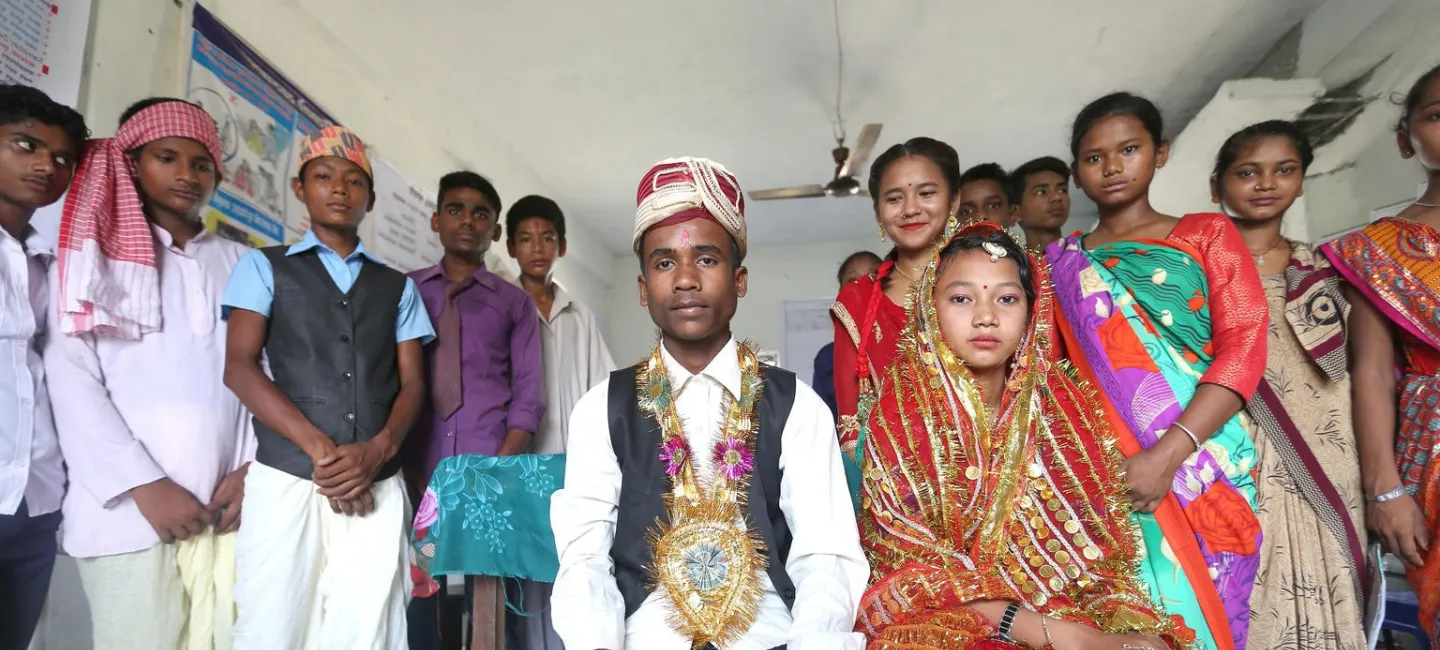 On 21 June 2018 in Nepal, Renuka Kumari Choudhary (left and seated), Rakesh Kumar Shah (right and seated) and other adolescents in Gujara Municipality of Rautahat District perform a skit on child marriage as part of UNFPA-UNICEF Global Programme on Ending Child Marriage. 
