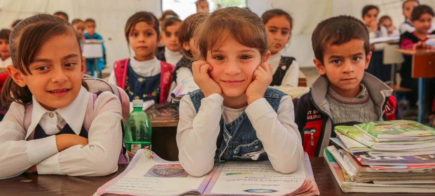 On 15th November, displaced children sit in class at Al-Yahyawa Tent School in Yahyawa IDP camp in Kirkuk Governorate, Iraq.  In November UNICEF celebrated the opening of three new schools for displaced children in Kirkuk Governorate, allowing more than 2000 displaced students to continue their education.