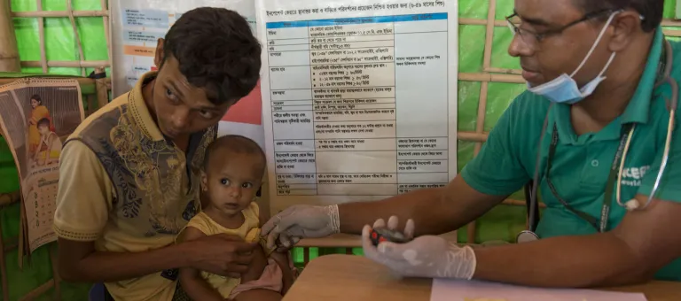 A Nutrient doctor is taking care of a rohingya baby at OPT center, Moinarghona refugee camp, camp 12, CoxÕs Bazar, Bangladesh on 3 April 2019.