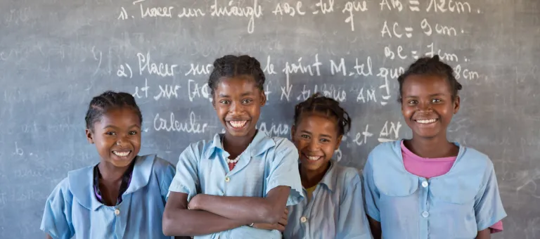 Soanafiny Fille de Jesus Clarta (second from the left), 14, studies in the secondary school of Berano (Anosy region). Thanks to the catch-up class (Let Us Learn), a UNICEF supported program she is now studying in third grade after stopping the school for a year