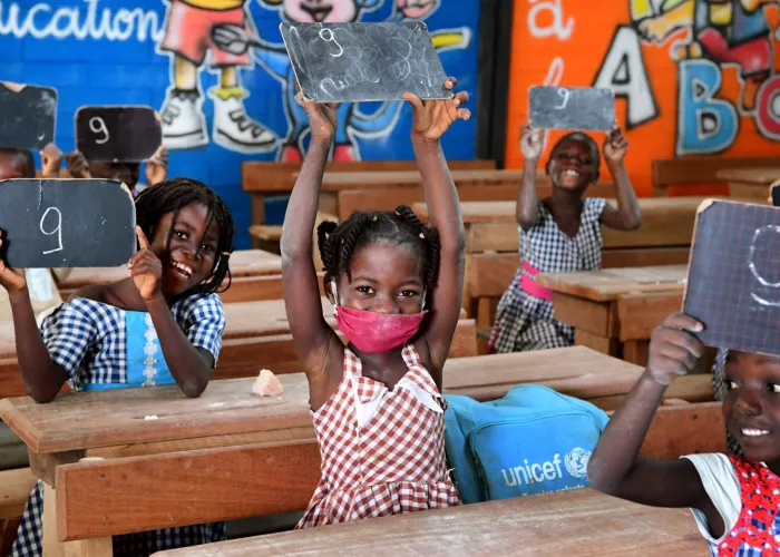 Children attending classes in Toumodi-Sakassou, in the center of Côte d'Ivoire.  Due to COVID-19, the schools were closed for several weeks. Classes started, with the necessary measures. Children wear masks, wash their hands regularly and keep a social distance.