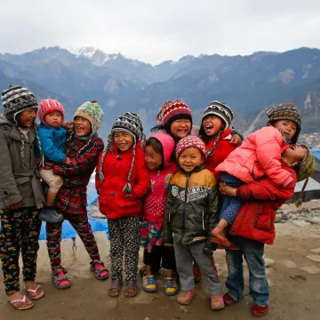 On 18 January 2016, children laugh in Barpak village, Gorkha district, Nepal. Barpak is an epicenteral village of Gorkha district, where more than 1400 hundreds houses were destroyed during the earthquake on 25 April 2015. Hundreds of earthquake victims, particularly the elderly and young children living in shelter of highland altitude have been facing a harsh winter season after snowfall.